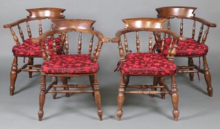 Four similar beech and elm smokers bow chairs, raised on turned supports with double H framed stretchers 