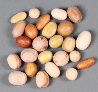 A collection of carved wooden model eggs 