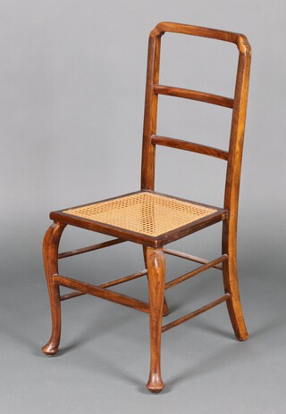 A 1930's beech framed ladder back bedroom chair with woven rush seat on cabriole supports 90cm h 