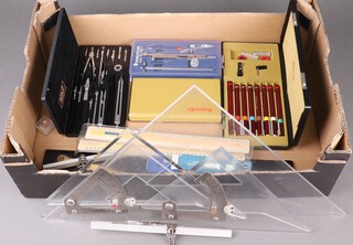A Wild geometry set, a wooden parallel rule and a collection of drawing instruments