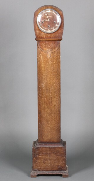 A 1930's Smiths Enfield striking granddaughter clock contained in an oak case 134cm h x 16cm w x 23cm d (no key or pendulum, the trunk has signs of old but treated worm)  