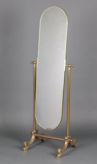 An arch shaped plate cheval mirror contained in a gilt metal frame 140cm h x 40cm w x 41cm d 