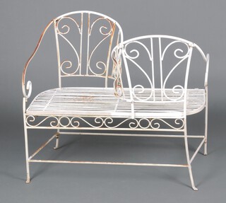 A Victorian style white painted metal conversation seat 90cm h x 102cm w x 50cm d (some rust) 