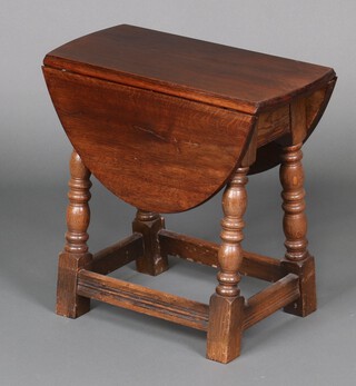An oak oval drop flap occasional table, raised on turned and block supports 47cm h x 47cm w x 21cm d  