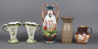 A Dresden style twin handled vase decorated ladies 33cm, a Brampton Cumbria Art Pottery vase 23cm, a pair of Rockingham green glazed and floral decorated jugs 19cm and a Doulton salt glazed hunting jug (chip to rim) 