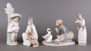 Four Lladro figures - Food for Ducks 4849, Shush Quiet Puppy 4522, Panchito 1059 and Girl with Lamb 1010 