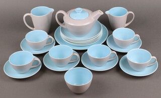 A Poole Pottery 22 piece blue glazed tea service with bread plate, 6 tea plates, teapot, 2 jugs, sugar bowl, 5 cups and 5 saucers 
