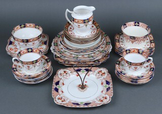 Forty three various pieces of Royal Crown Derby style tea ware comprising 2 large plates (1 rings flat), 3 twin handled plates, 5 tea plates (3 rings flat), 10 various square plates, cake stand (rings flat), 2 sugar bowls (rings flat), milk jug, 2 tea cups, 20 saucers (2 rings flat) 