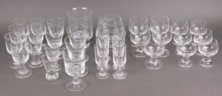 A suite of Dartington Victoria Claret pattern drinking glasses comprising 2 pars of rummers, 5 goblets, 7 tapered glasses, 6 brandy balloons and 6 liqueurs 