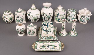 A Masons Chartreuse pattern cheese dish and cover, rectangular tray, pair of candlesticks, jar and cover, ginger jar and cover, 3 urns and covers, etc 