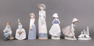 Seven Nao figures - lady with bonnet, girl with puppy, girl with bonnet, boy with rabbit, girl with hoop and 2 others