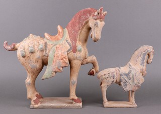 A Tang style figure of a standing horse 39cm, 1 other 23cm 