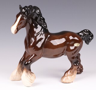 A Beswick figure of a brown shire horse, cantering, no.975 20cm 