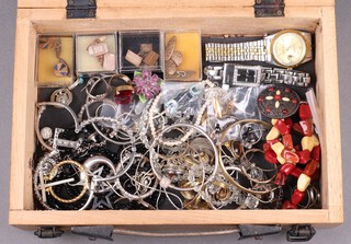 Three gilt metal pairs of cufflinks and a collection of costume jewellery and wristwatches contained in a wooden box 