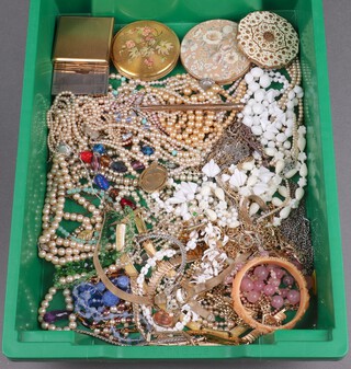 A collection of costume jewellery including compacts, simulated pearls and necklaces, bangle etc