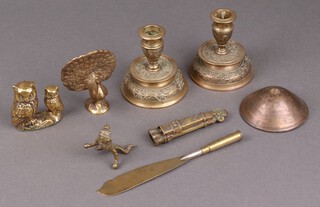 A pair of Indian brass candlesticks 10cm, brass figure of a peacock and a collection of brassware 