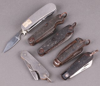 Five military style folding jack knives (1 blade a/f), together with a multi bladed knife 