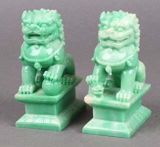A pair of green resin figures of Dogs of Fo 11cm, cased