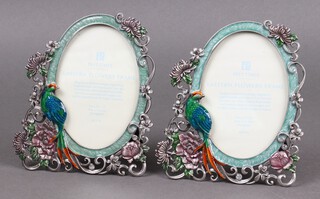 A pair of Past Times enamelled easel photograph frames decorated peacocks 15cm 