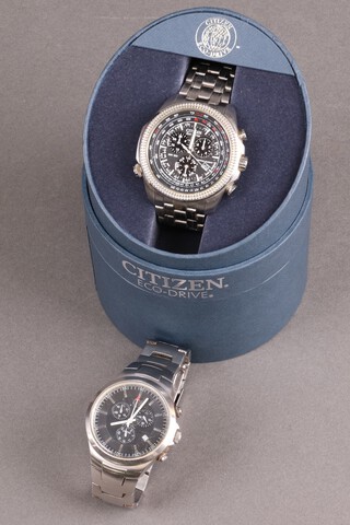 A Citizen Eco-Drive wristwatch boxed and a Guess wristwatch 