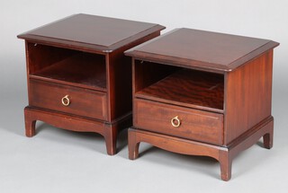 Stag, a pair of mahogany bedside cabinets with recess above drawer, raised on square tapered supports 50cm h x 53cm w x 47cm d 