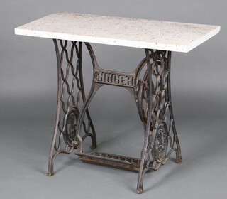 A garden table formed from the base of a Singer treadle sewing machine and with rectangular granite top 74cm h x 92cm w x 43cm d 