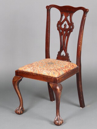 A 1930's Chippendale style mahogany dining chair with pierced vase shaped slate back and upholstered drop in set on cabriole supports 