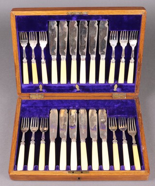A canteen of silver plated fish knives and forks for 12, contained in an oak box 
