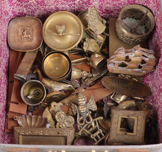 A pair of 1930's pierced brass bookends in the form of a galleons and a collection of brassware, contained in a small suitcase