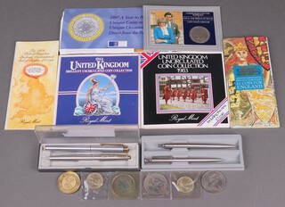 Two Parker fountain pens, 2 Parker ballpoint pens and a collection of modern commemorative coinage 
