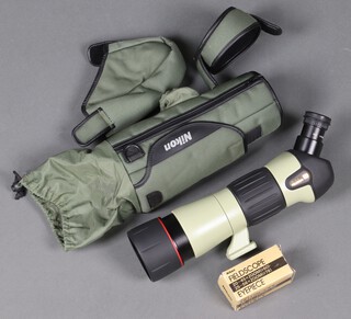 A Nikon binocular field scope together with an extra eye piece and waterproof carry case 