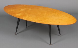 A Dutch mid-century oval plywood coffee table on outswept ebonised supports, the base marked Made in Holland 38cm h x 124cm w x 58cm d 