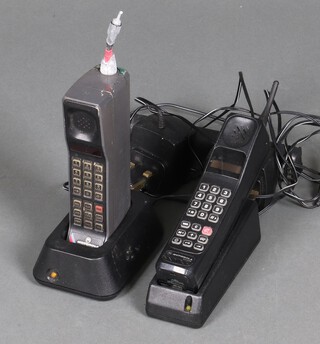 A collection of 1980's mobile phones with chargers (unknown if associated) including a Motorola 888 and a Motorola 8500X, all in poor condition 
