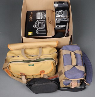 A collection of cameras and accessories to include a boxed Nikon D70S kit complete with lens, a Nikkor 70-300mm F/4-F/5.6 lens., a Panasonic V720 hand held video camera, a Canon Powershot A80 and a Billingham camera bag and a Nikon camera bag 