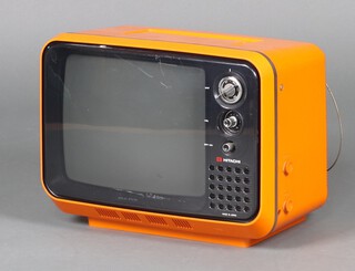 A Hitachi solid state TV in orange model F-54G-311 