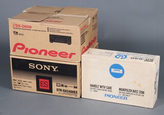A Sony STR-DA24 00ES multi channel AV receiver (boxed) together with a pioneer VSX-D608 multi channel receiver and a Pioneer SA-540 integrated amplifier 