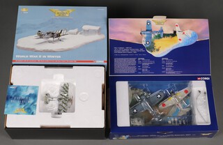 A pair of Corgi Aviation Archive models to include World War Two War in the Pacific Set containing a F4U-1 Corsair  and a Mitsubishi A6M2 Zero and a World War Two In Winter J-8A Gladiator with Skis and Diorama ,1:72 scale, boxed
