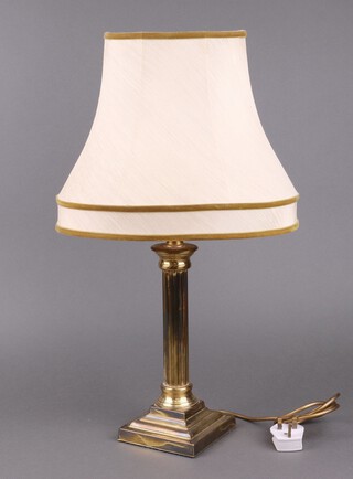 A gilt metal table lamp with reeded column on a square stepped base 29cm h 