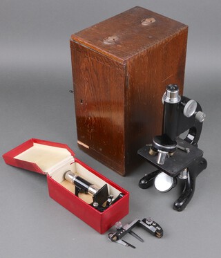 A Black Beck Ltd London model no.29 single pillar microscope contained in an oak case together with a students single pillar microscope contained in a paper case 