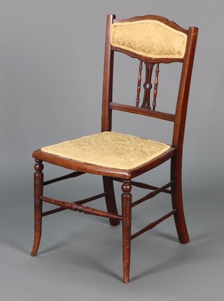 An Edwardian inlaid mahogany bedroom chair, the seat and back upholstered in yellow material 78h x 39w x 36d 