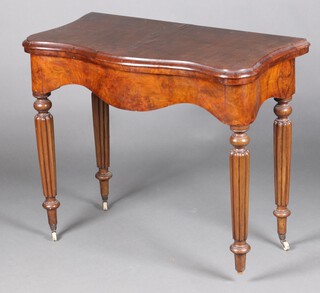 A Victorian walnut card table, raised on turned and reeded supports with caps and ceramics casters (1 caster missing) 75h x 90w x 46d (old treated worm to the back board, patch to the top)