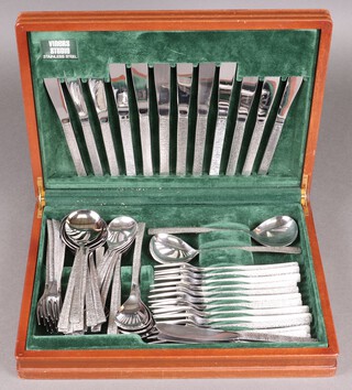 A Viners 68 piece Studio stainless steel canteen of flatware comprising 6 table knives, 8 tea knives, 21 forks, 2 serving spoons, 11 soup spoons, 13 table spoons, 7 tea spoons, all contained in a teak canteen