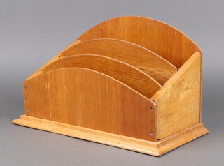 An oak arch shaped 3 section stationery rack 20h x 32w x 17d 