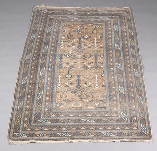 A brown, white and green ground Caucasian rug with central field within a multi row border 181cm x 126cm 