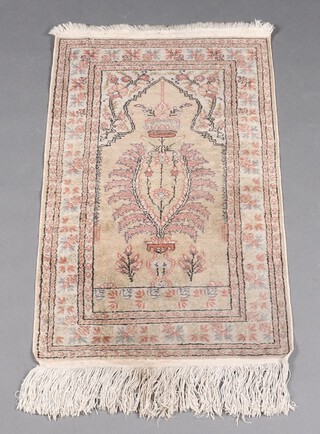 A pink and blue ground Persian prayer rug with mihrab to the centre 106cm h x 59cm w 