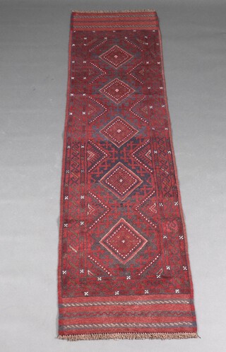 A blue and red ground Meshwani runner with 5 octagons to the centre 253cm x 63cm 