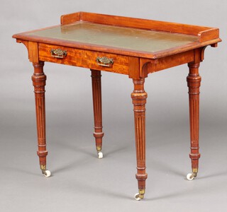 Lamb Manchester, a Victorian writing table with 3/4 gallery and green inset writing surface, fitted 1 long drawer marked Lam Manchester 3116, raised on turned and fluted supports with ceramic casters 75cm h x 90cm w x 50cm d 