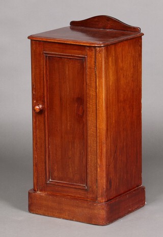 A Victorian mahogany pot cupboard with raised back, the interior fitted a shelf enclosed by a panelled door 80cm high x 38cm w x 33cm d 