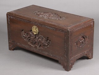 A 1920's carved oak camphor coffer with hinged lid decorated a rickshaw, the interior fitted a tray 47cm high x 92cm w x 45cm d 