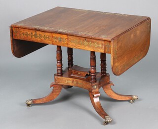 A Regency inlaid rosewood and brass pedestal sofa table, fitted 2 frieze drawers, raised on turned column with triform base, splayed feet ending in brass caps and casters 70cm h x 87cm w x 65cm d 